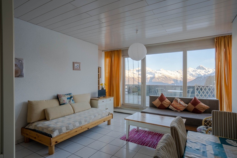 Kindvriendelijk resort met zwembad en panorama op de Zwitserse Alpen